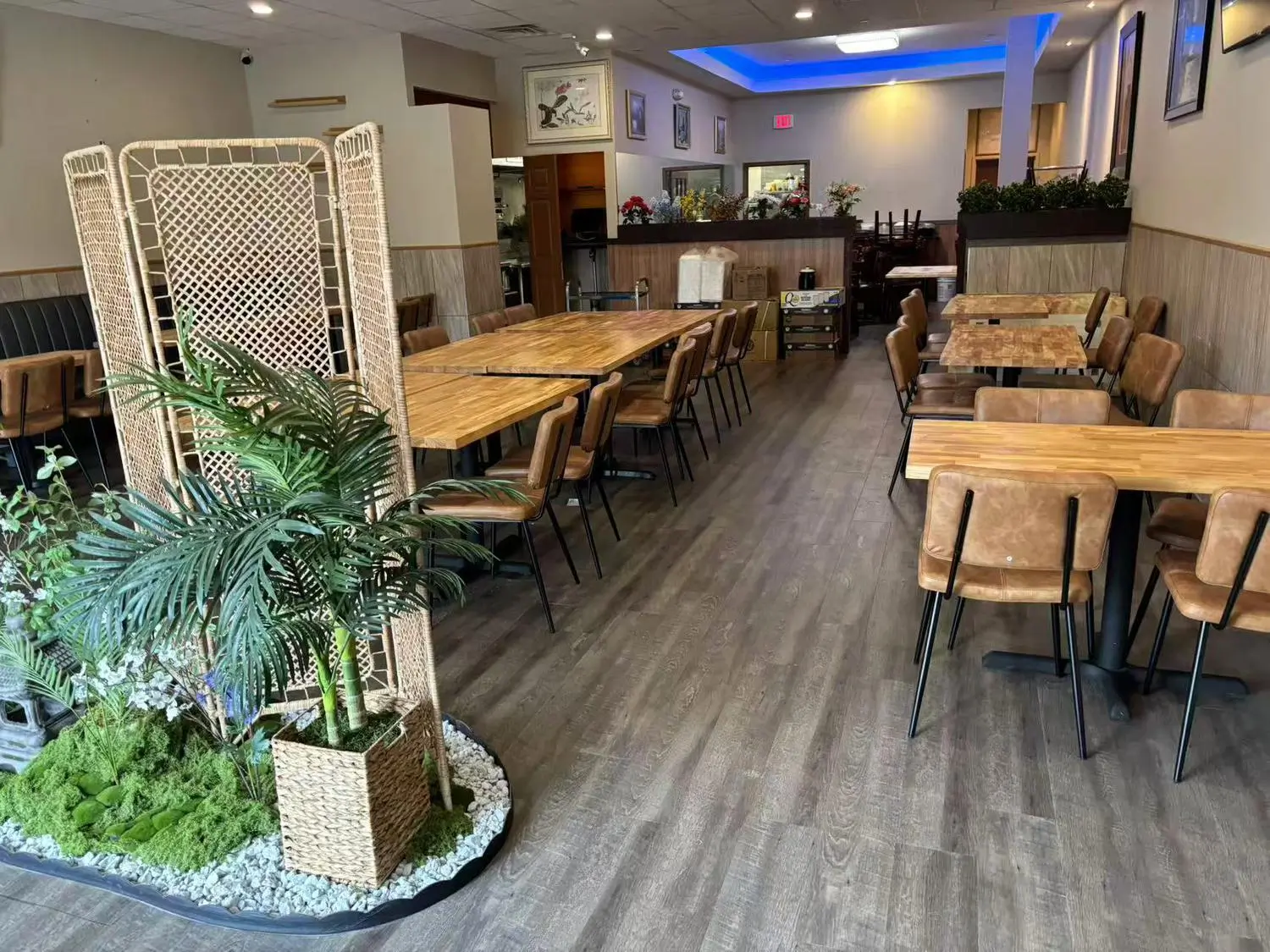 Chef-X-Chinese-restaurant-Restaurant-Dining-Area-With-Plants-NJ Restaurant Dining Area With Plants features a dining space adorned with potted plants and a woven partition at Chef X, a Chinese restaurant in NJ